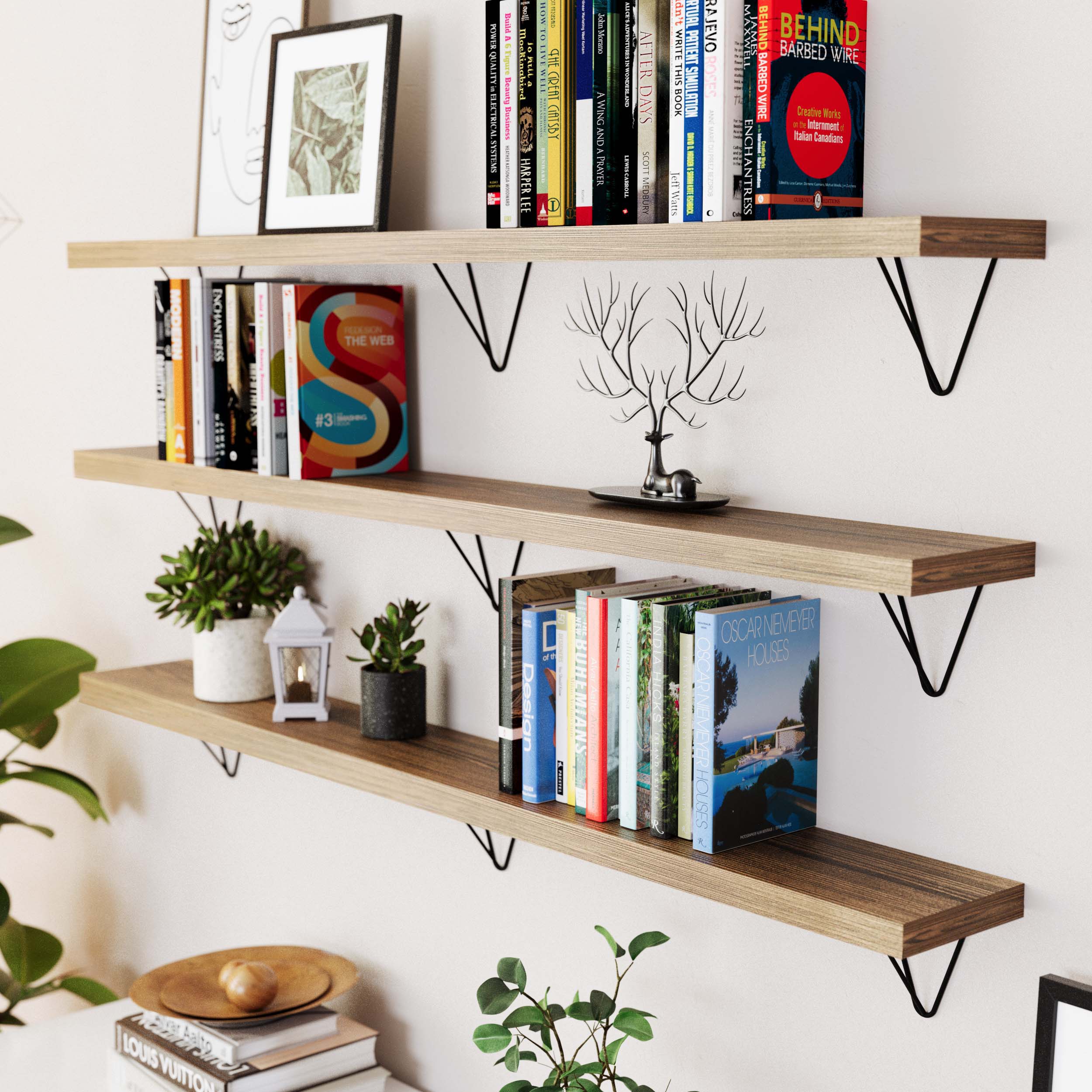 Living room with wooden shelves supported by black triangular heavy duty brackets, displaying books and wall decor.