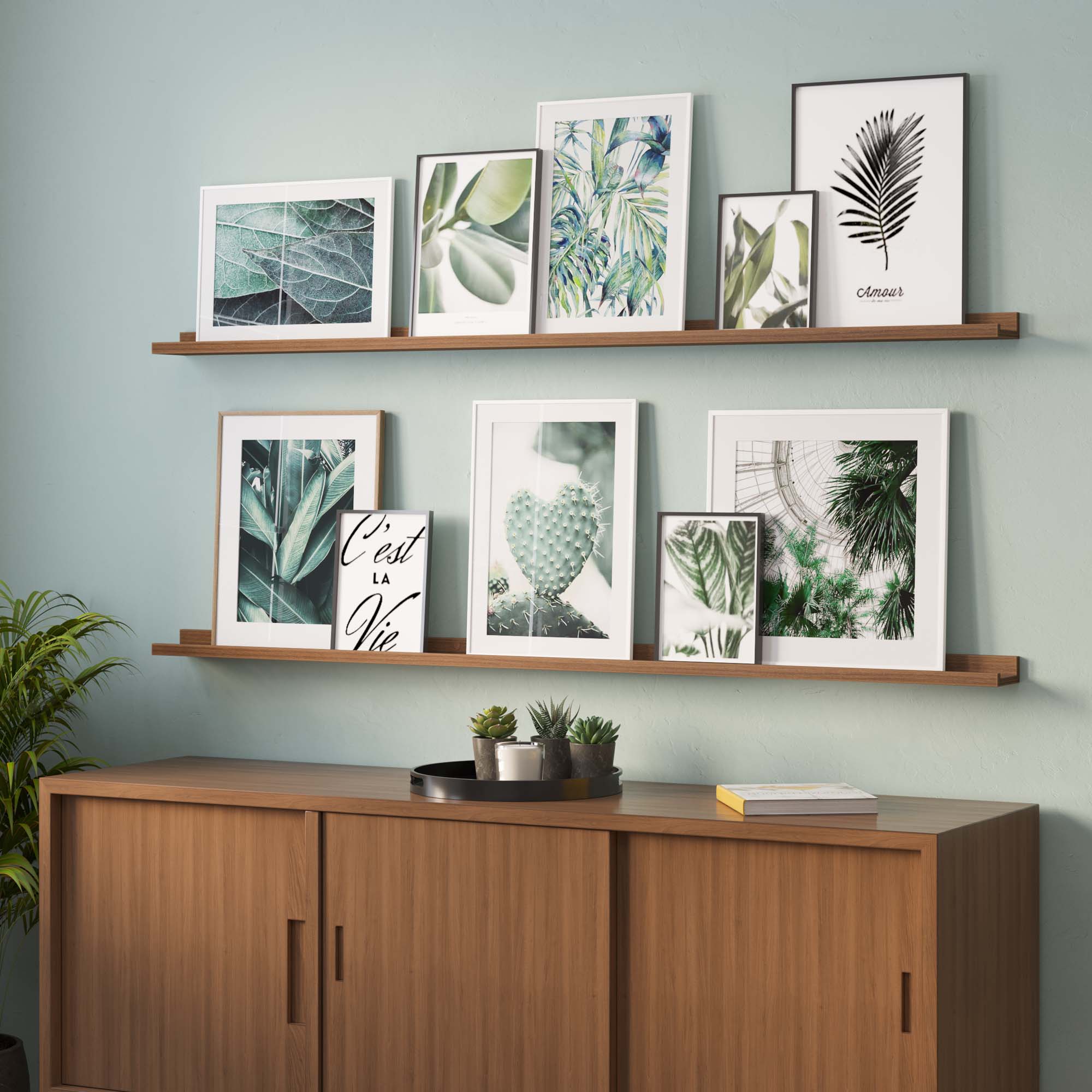 Living room shelves displaying a curated selection of green-themed botanical art pieces, enhancing the room's natural ambiance.
