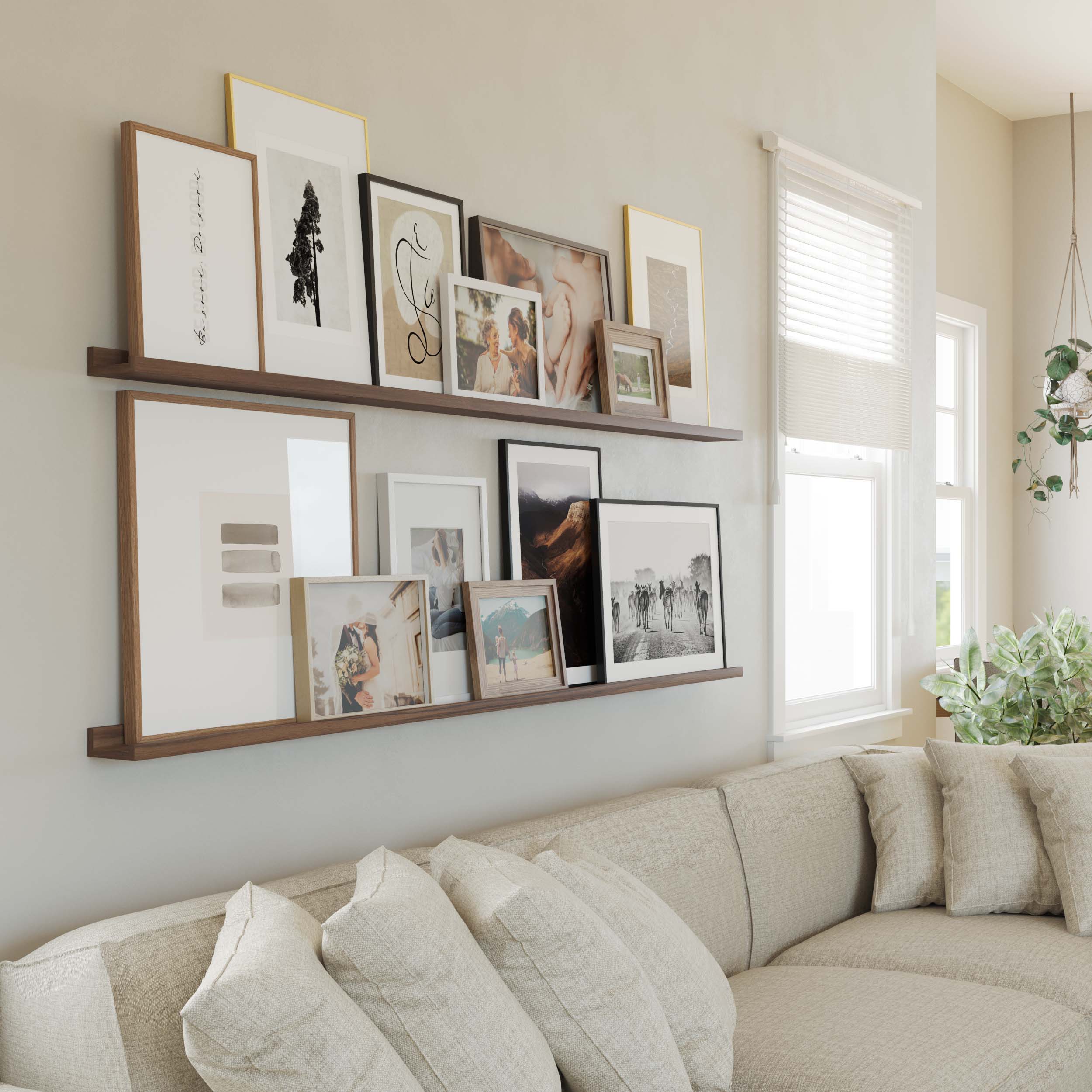 A living room wall adorned with 2 walnut display shelves exhibiting a variety of framed art, adding character to the cozy space.