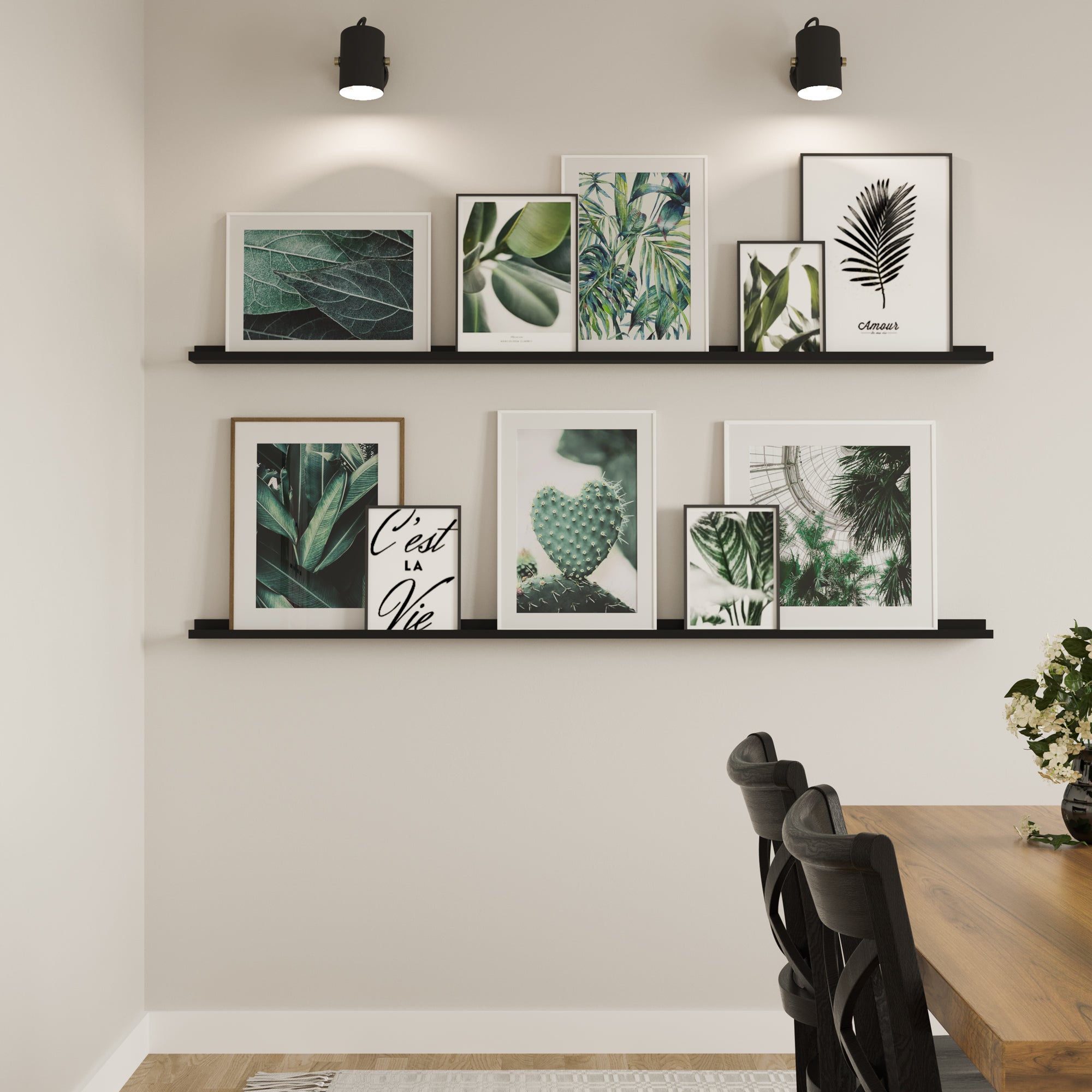  A dining area featuring two floating shelves black on the wall, adorned with framed botanical art prints, creating a serene atmosphere.
