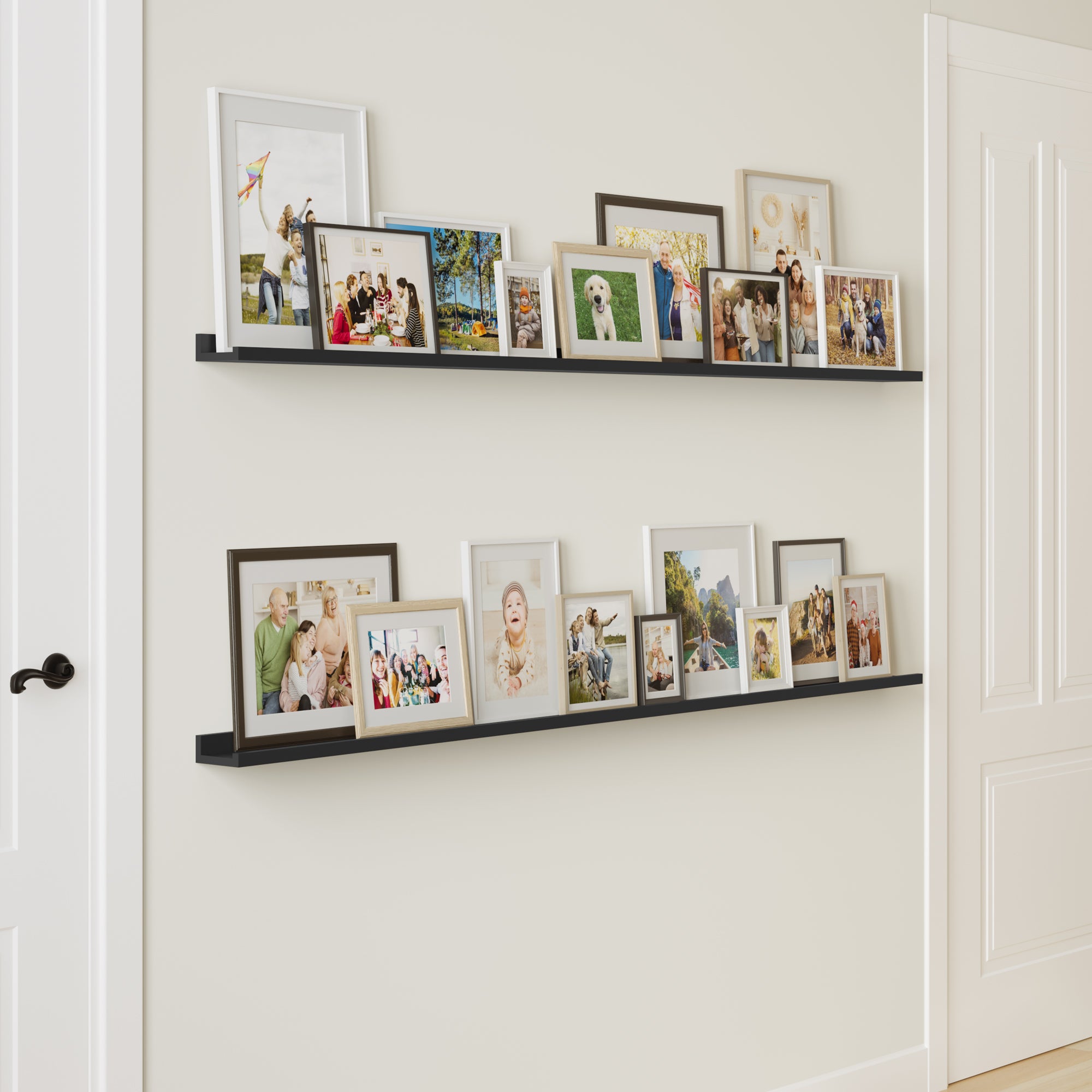 A hallway with a long black shelf displaying an array of colorful framed family photos, creating a personal touch.