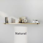 Natural finish floating book  shelf styled with books, candle, vase, and clock. Clean white background highlights the light wood tone and minimalist décor.