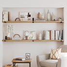 Two 72 inch display shelves elegantly arranged, offering ample space for books, decor items, and framed pictures, ideal for a cozy reading nook.