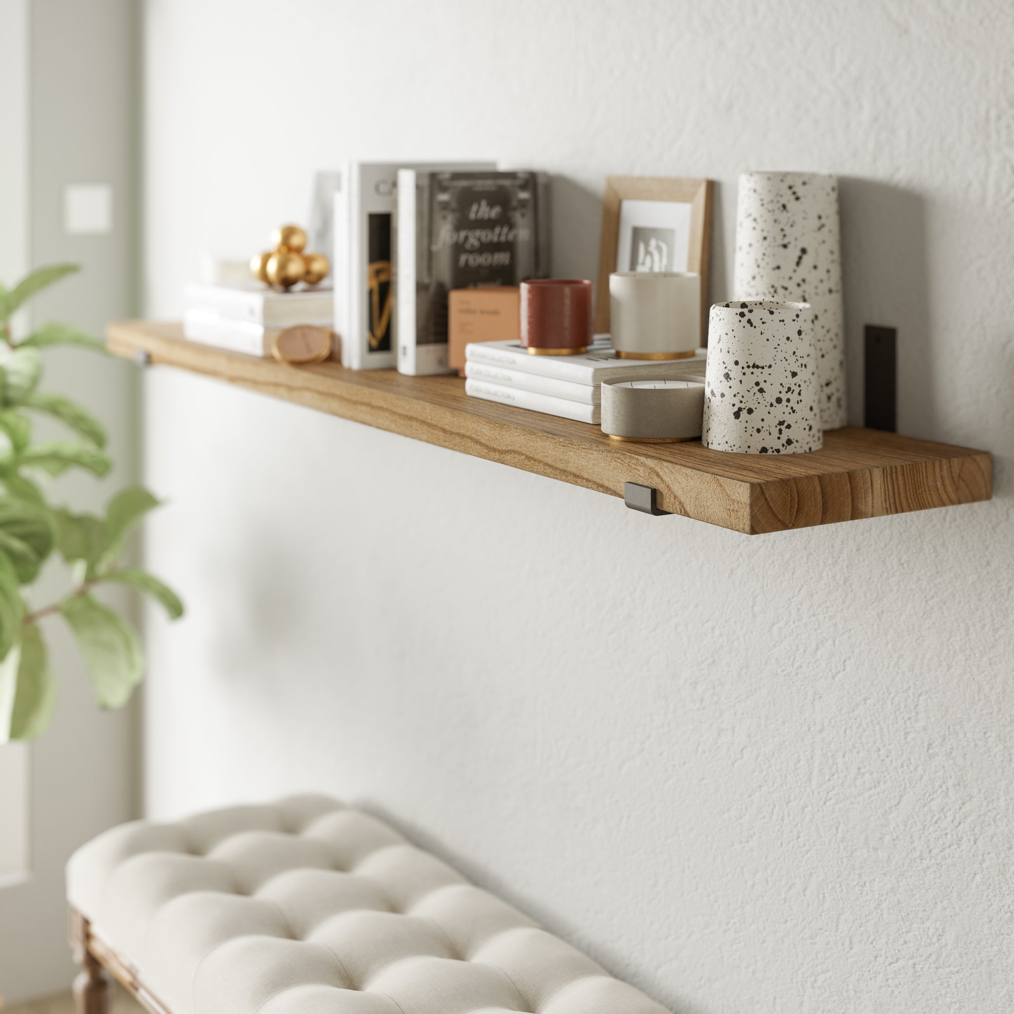 60'' wood shelf with books and décor against a textured wall, close-up.