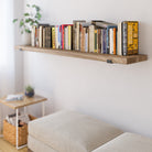 A single rustic storage shelf filled with books, offering a sleek and compact solution for extra storage, blending function with minimal aesthetics.