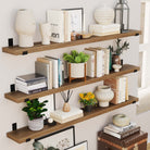 Triple-tiered long rustic shelves for wall decor filled with books, plants, and decor items. Perfect for maximizing vertical storage space and adding a touch of elegance to your living room or study area.
