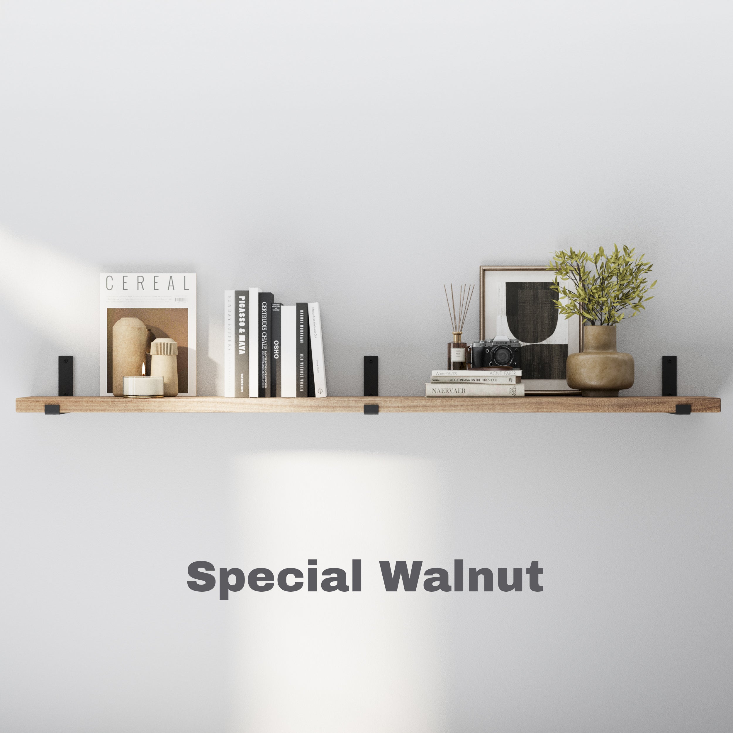 A single wall-mounted shelf in a light walnut finish, styled with neutral-toned books, vases, a framed artwork, and small home accessories. Simple yet elegant for modern interiors.