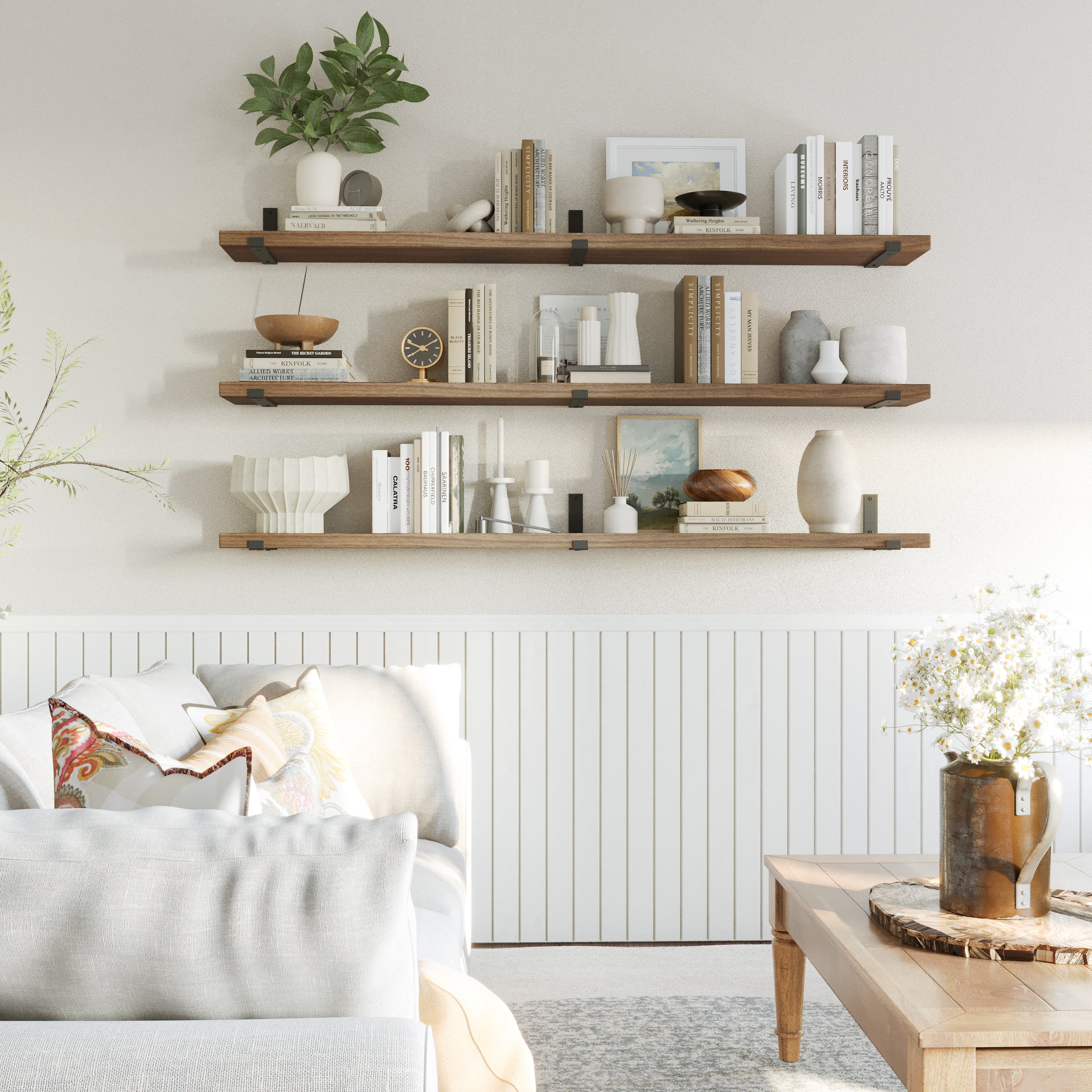 Three Provincial finish wall shelves elegantly showcase neutral-toned books, vases, and framed art. Perfect for creating a serene and balanced living room atmosphere with soft contrast and depth.