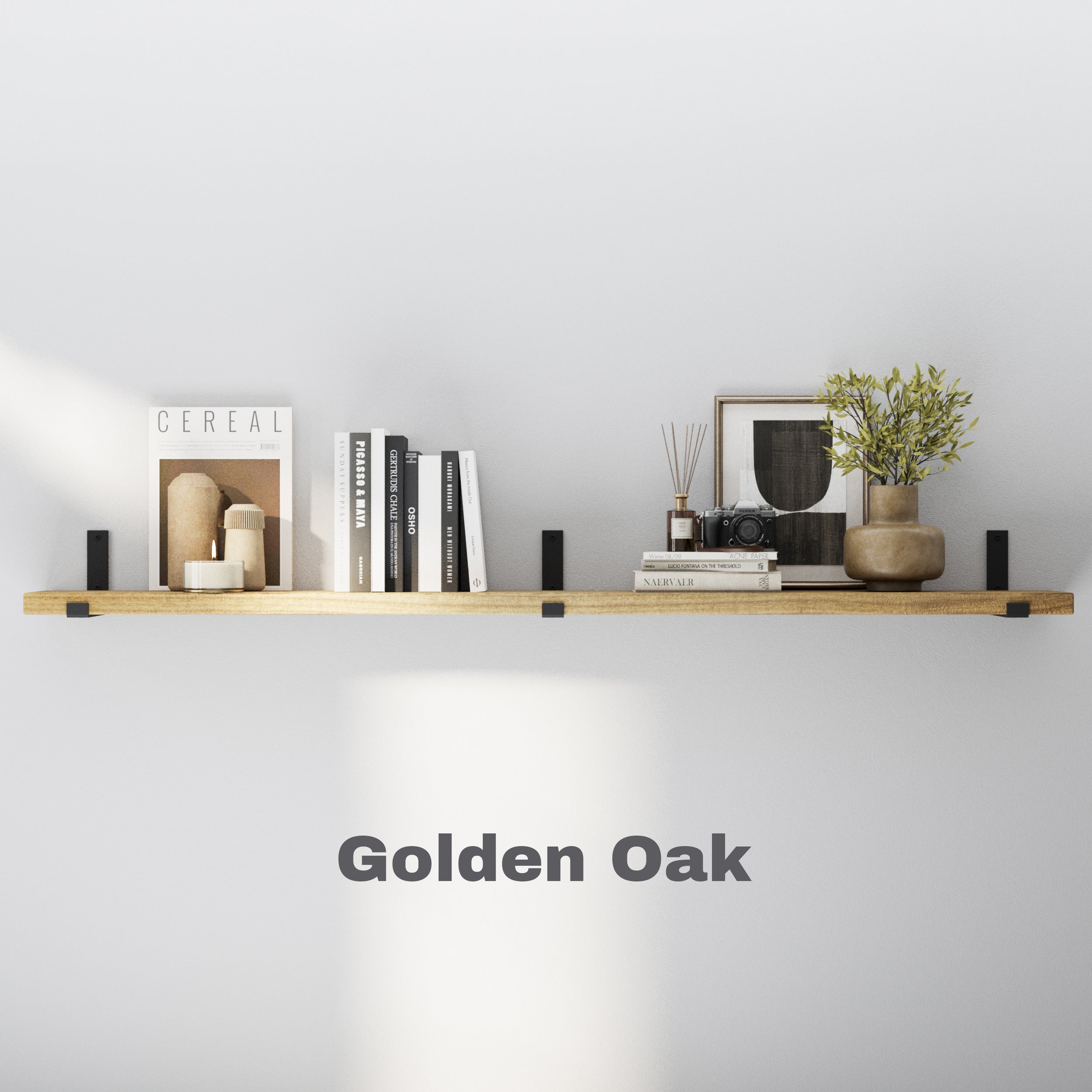 Golden Oak floating shelf styled with books, vases, and decor. Bright natural tone offers warmth and blends effortlessly with light wall backgrounds.