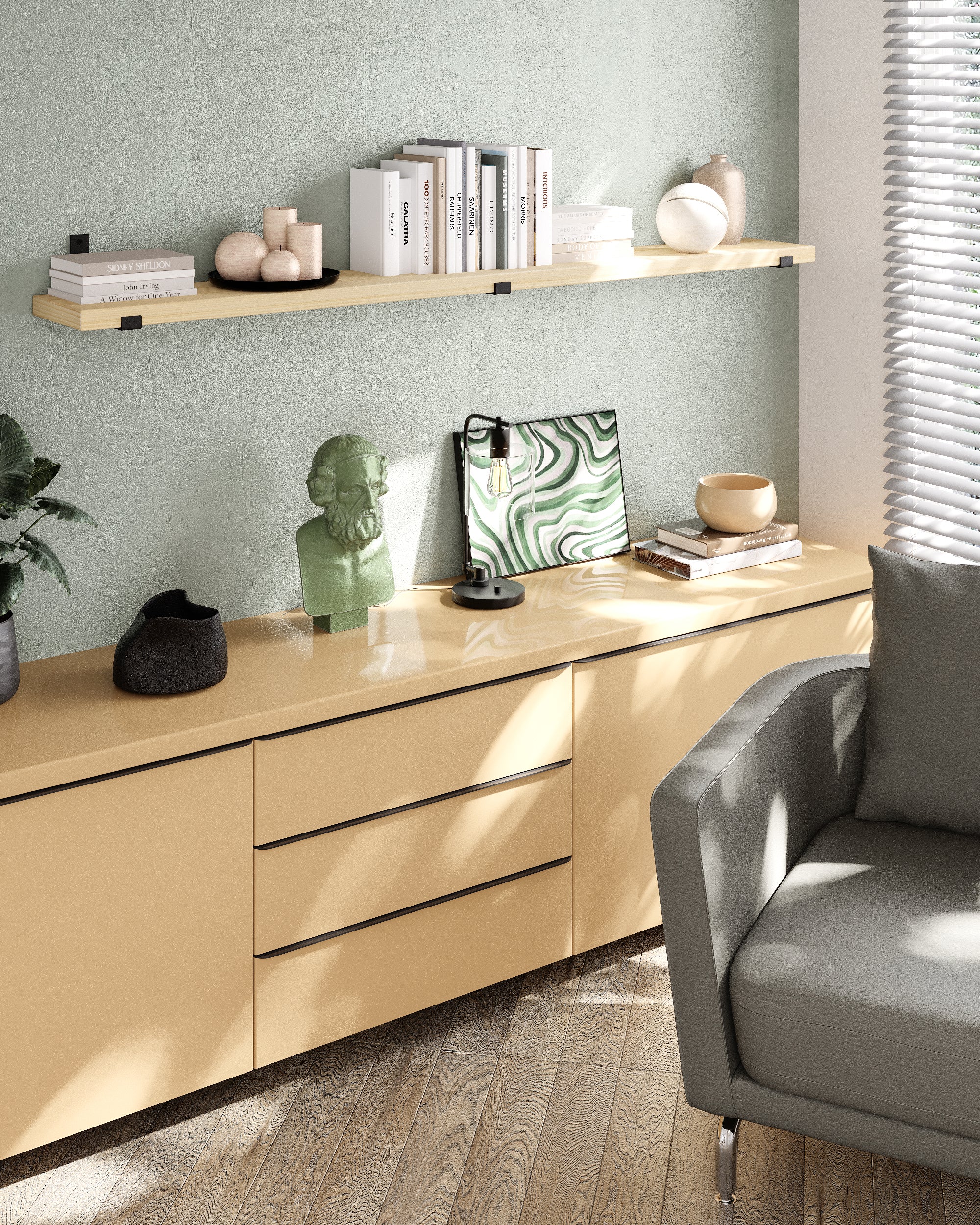 Single living room floating shelf over a muted green wall and beige cabinet creates a light, serene accent with books and minimalist décor under natural daylight.