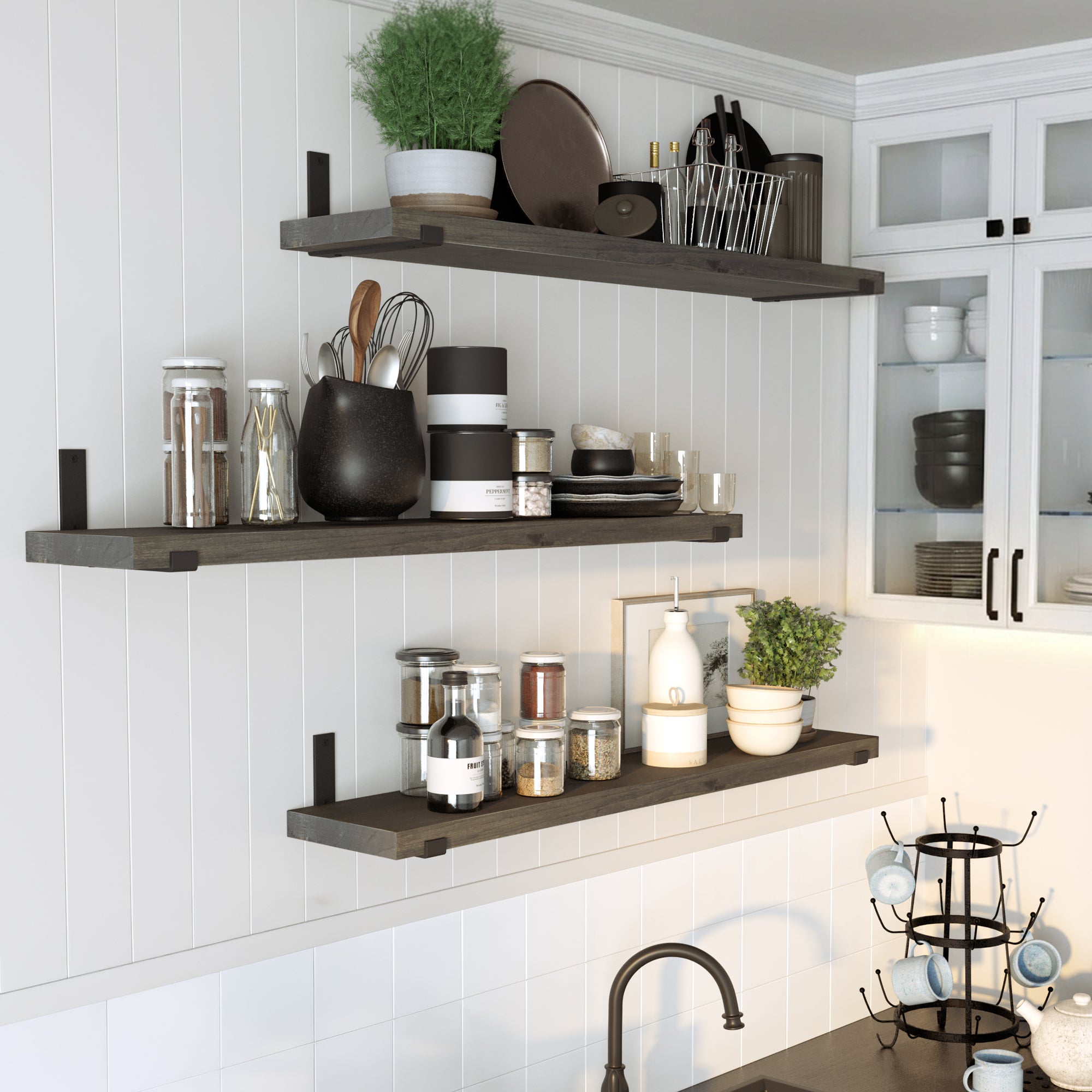 Kitchen setup with multiple dark floating shelves for kitchen storage holding jars, utensils, and decor, demonstrating practical storage and stylish organization in a modern space.