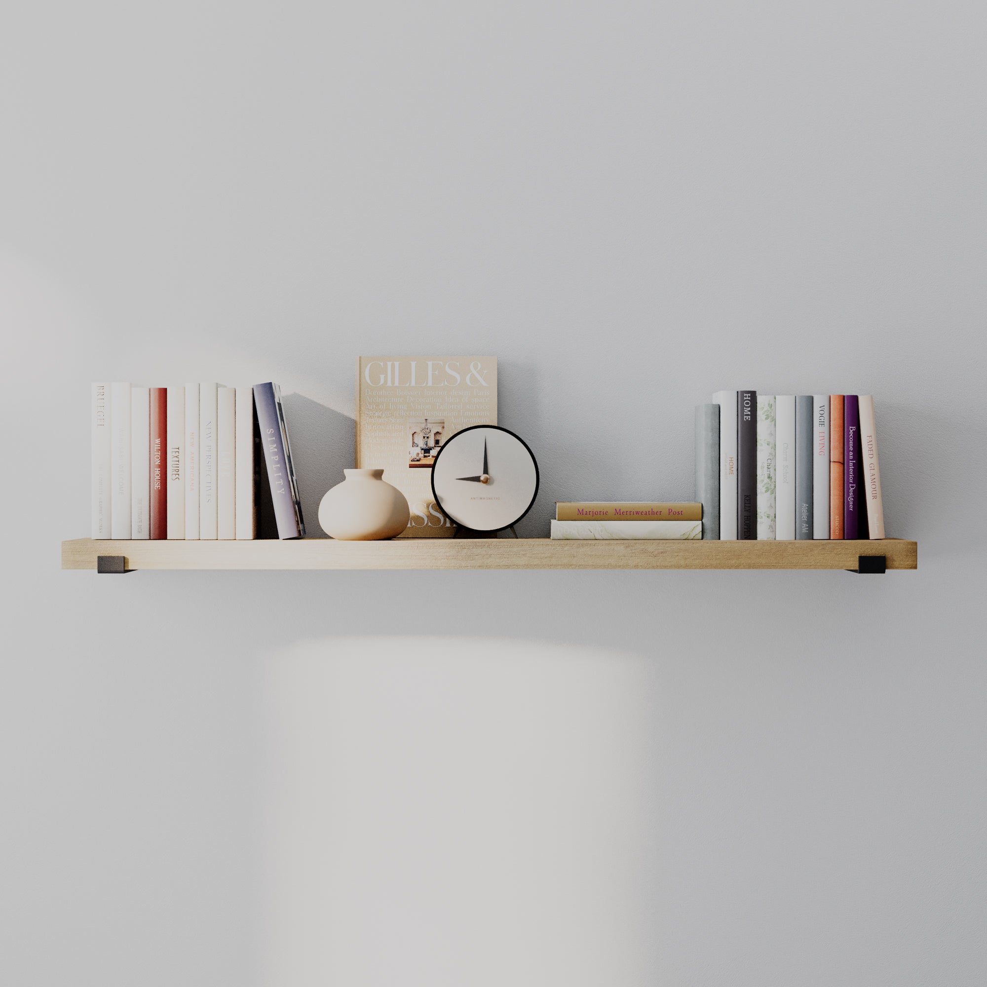 A long farmhouse shelf in a rich golden oak finish with books, clock, and décor. Balanced, minimal styling emphasizes length, wood grain, and sleek wall-mounted appearance.