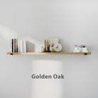 60 inch long golden oak floating shelf styled with books, candle, vase, and clock. Clean white wall highlights warm wood tone and minimalist décor balance.