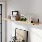 Wooden shelf with decorative items against a white wall