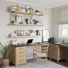 A home office with 60 inch long office book shelves with a premium natural finish. Spacious floating wall shelves keep books, office supplies, and décor neatly displayed while adding warmth and modern style to your home office.