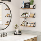 Bathroom with floating shelves supported by triangular black metal brackets, perfect for organizing toiletries.