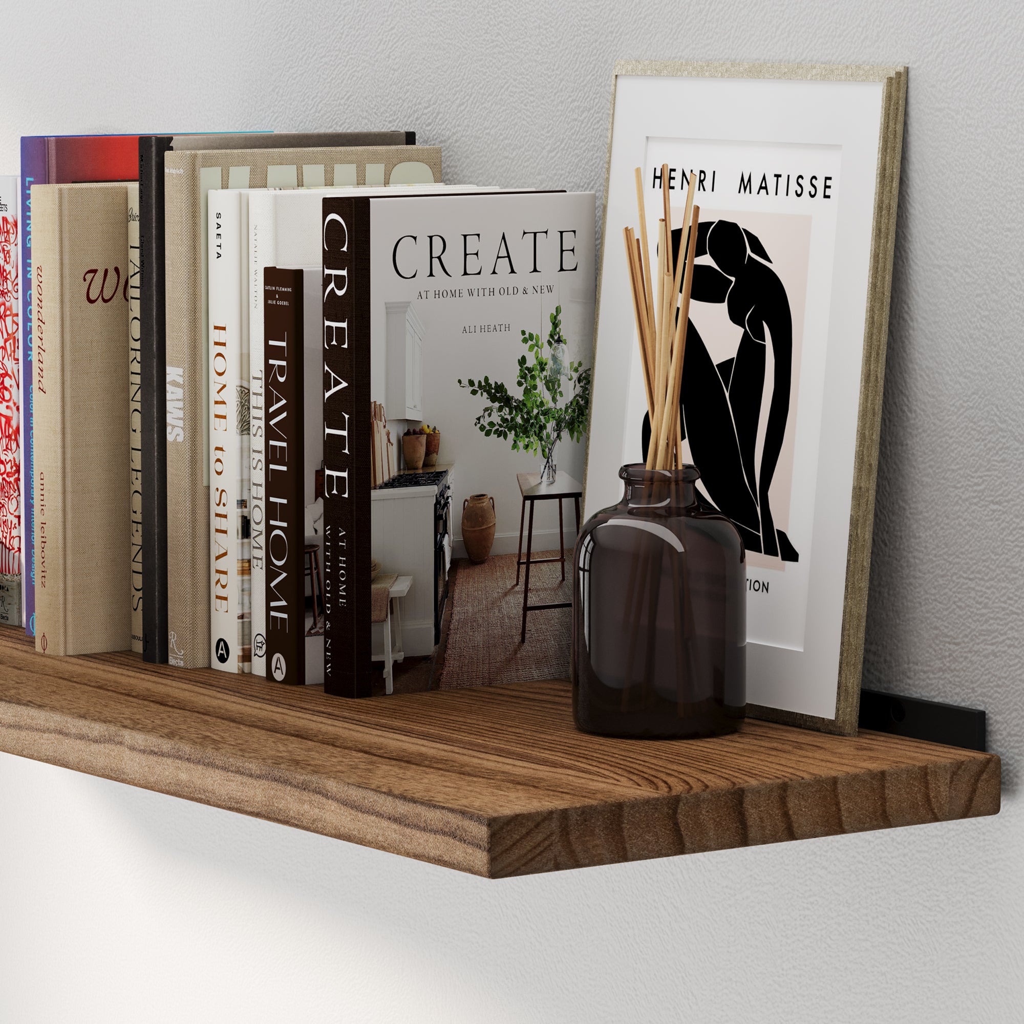 A hanging shelf for wall decor featuring a rich burnt finish and natural wood grain detail. This long shelf offers sturdy wall-mounted storage for books, framed prints, and decorative accents in modern rustic interiors.
