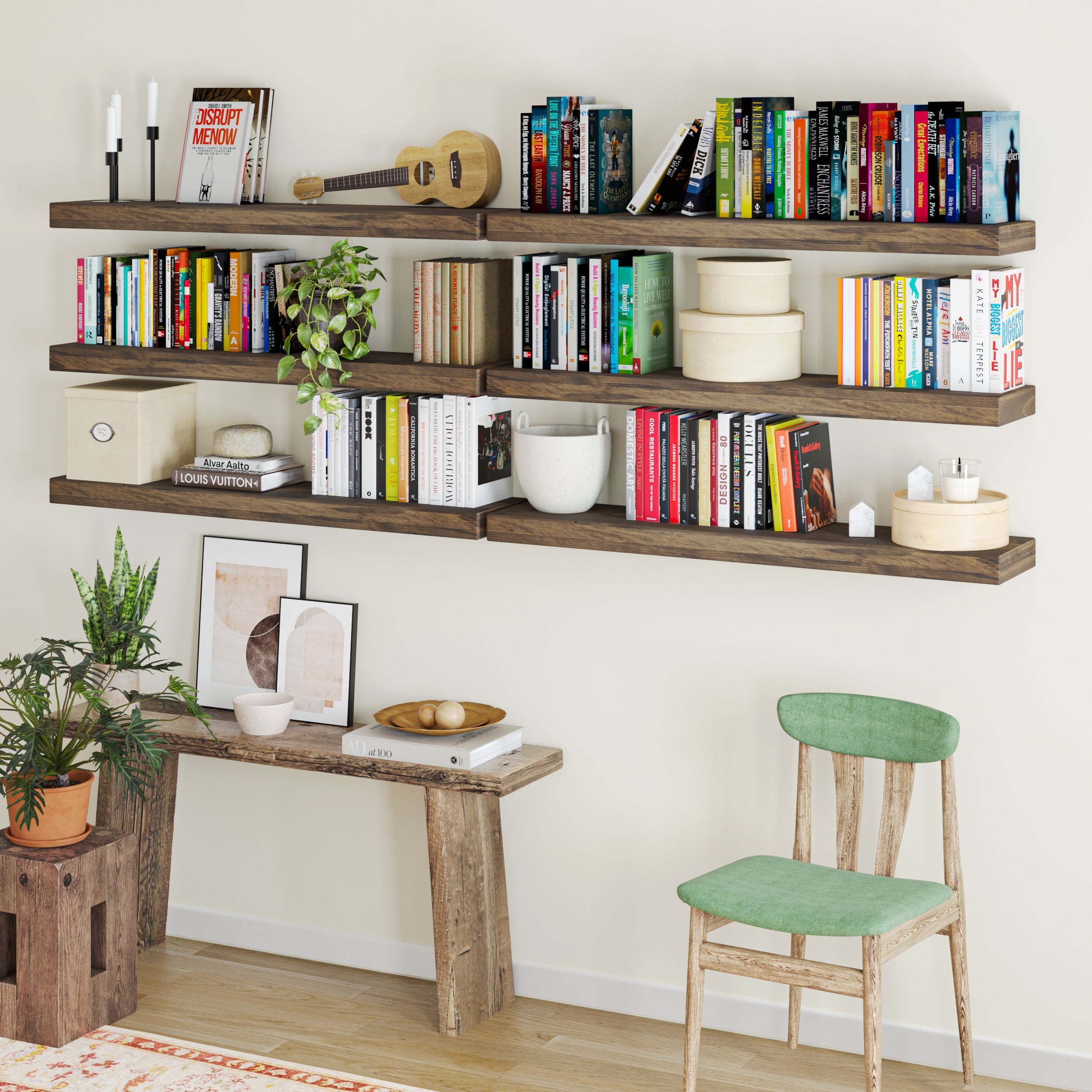 A creative bookshelf setup features multiple dark wood ledges filled with colorful books, plants, and decorative accents, transforming the wall into a stylish home library.