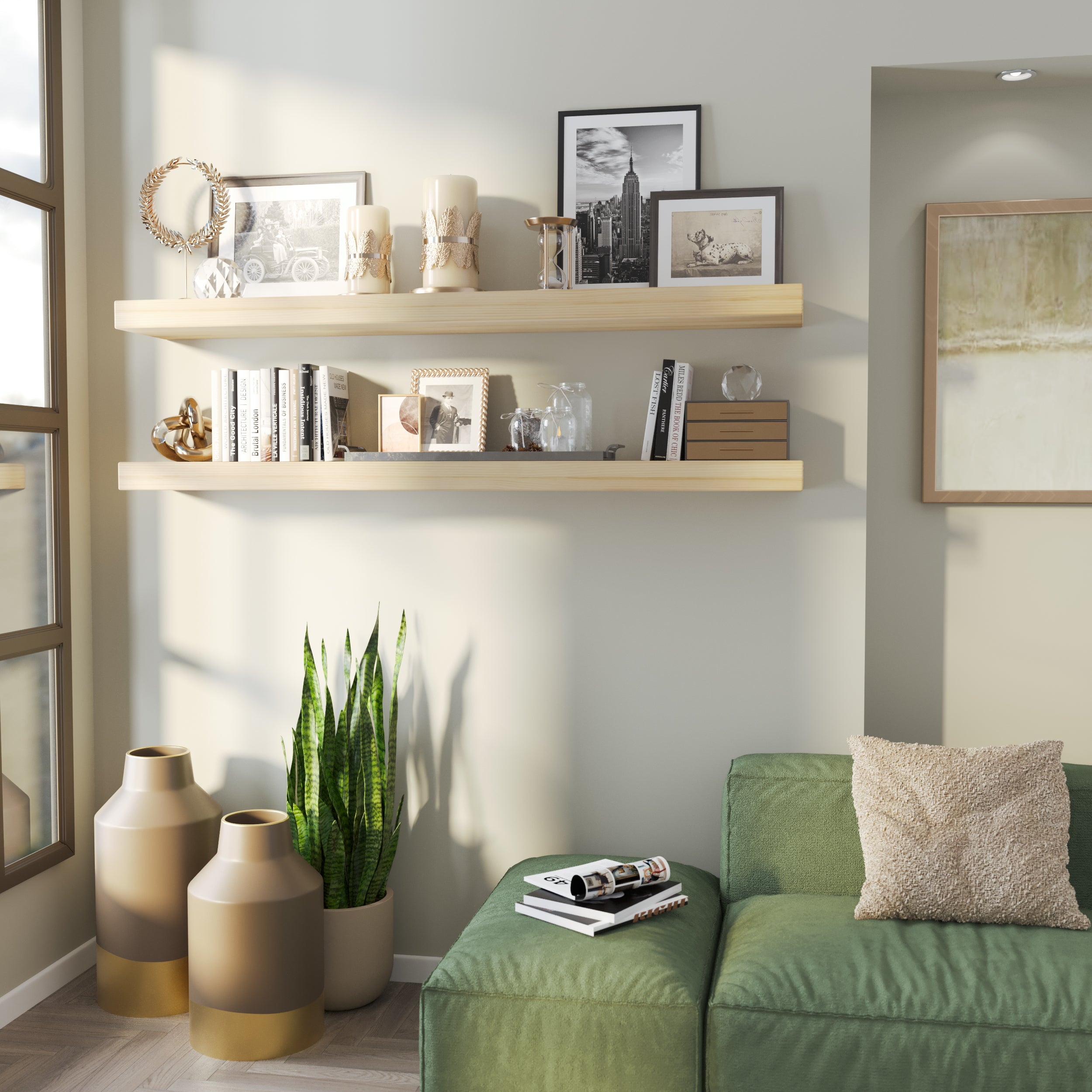 Two floating wooden shelves in a natural finish adorn a cozy corner with black-and-white photos, candles, and decor, complementing the soft lighting and green seating below.