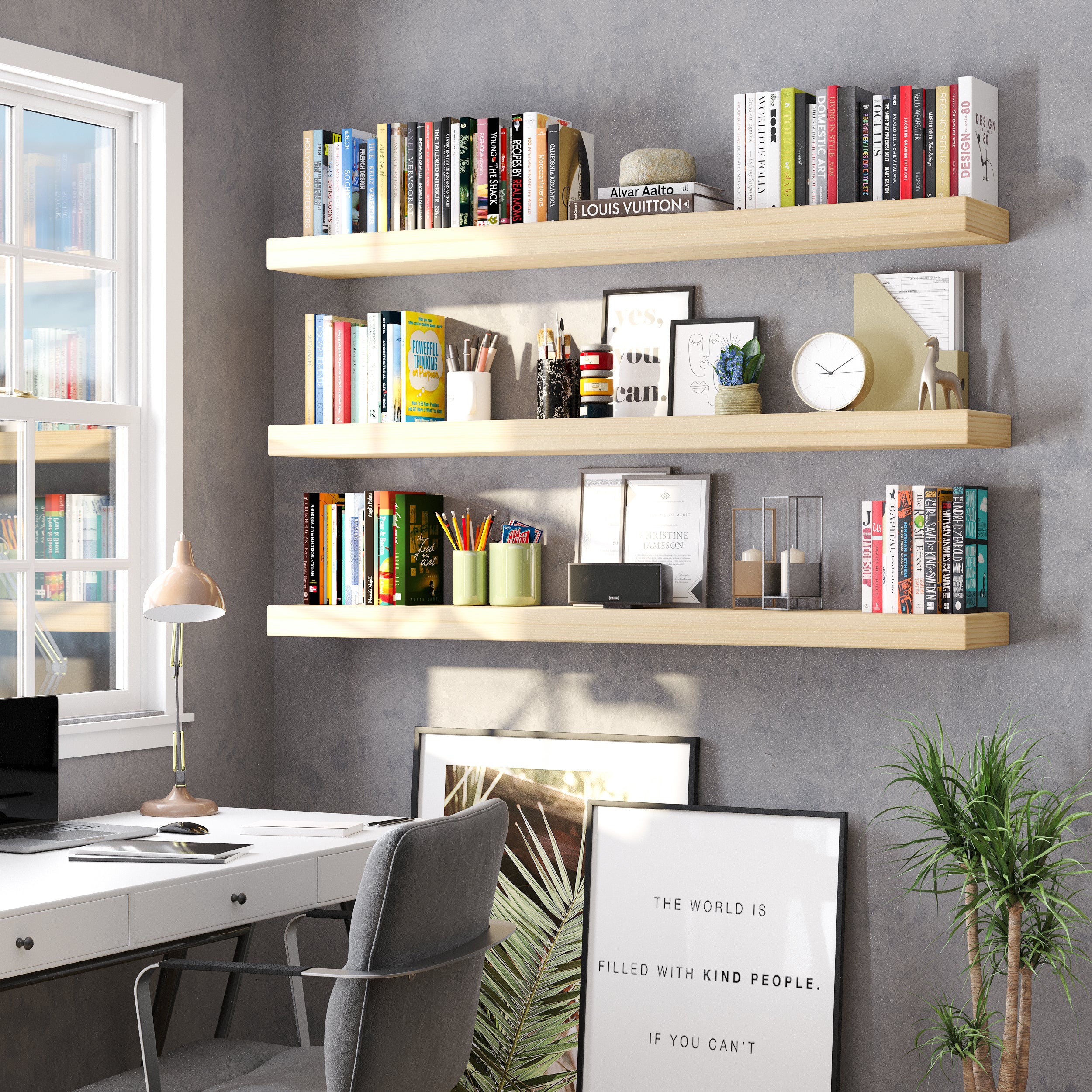 An elegant home office setup with three ultra thick boho shelves in natural finish, organizing stationery, books, framed art, and accessories above a modern desk by the window.