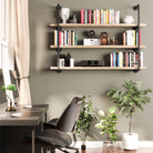 Decorative items on PIPE 60'' Floating Pipe Shelves; sturdy iron brackets and burnt wood for industrial elegance.