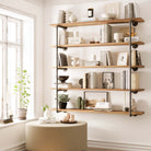 60 inch long wall mounted farmhouse shelf in a burnt finish, designed as a 5 tier bookshelf for living room, office, or bedroom storage. Rustic wood shelves and heavy-duty pipe brackets create modern farmhouse wall décor.