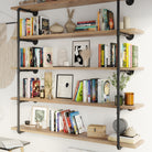 A stylish living room setup with the multi tier floating shelf unit with pipe shelving brackets, filled with books and decorative objects. The wall mounted pipe shelves blend seamlessly with the decor, adding both storage and style.