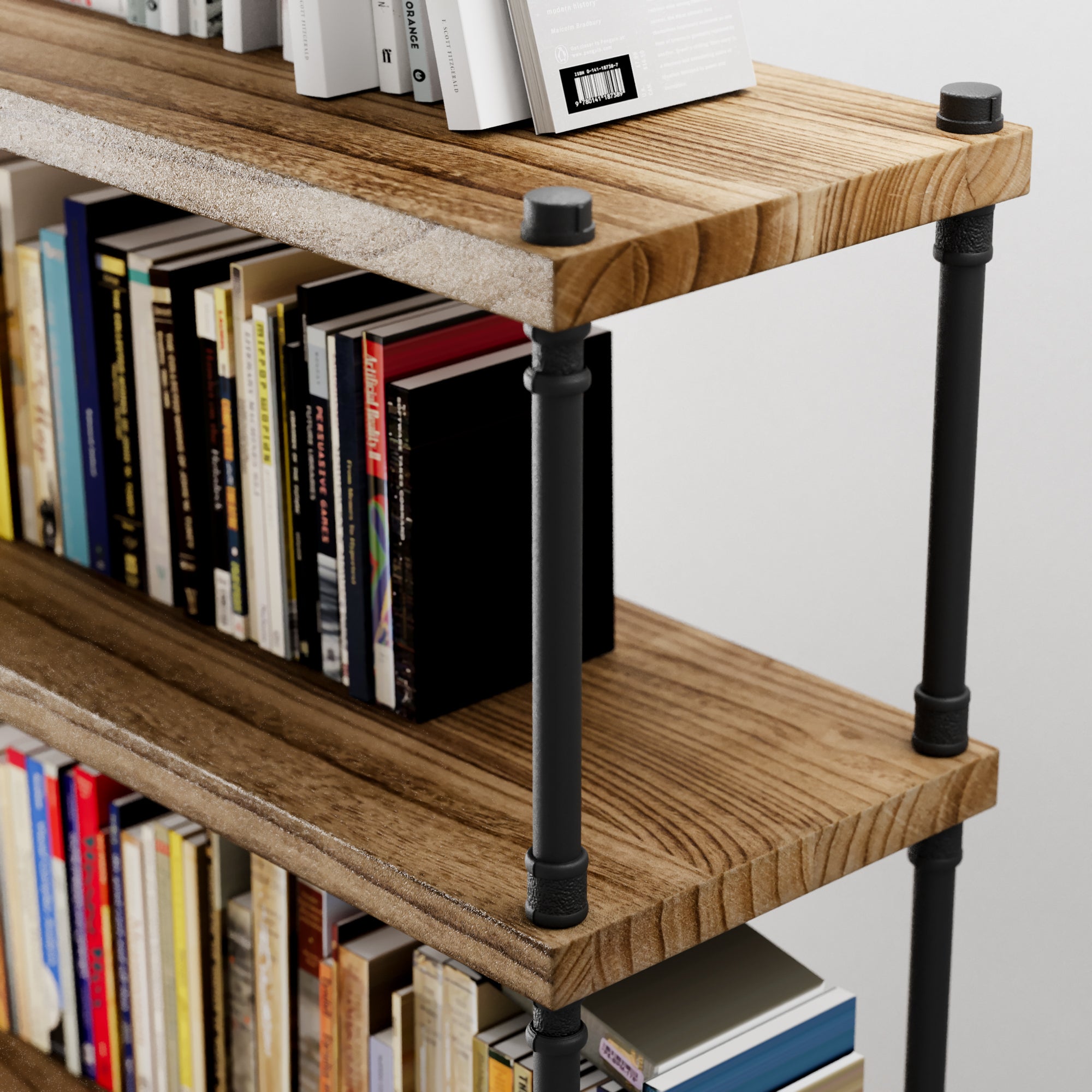 Hanging bookshelf with black metal legs holding books against a white wall