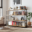 A long, 4 tiered hanging shelf for wall decor with books and decor items in a room with a plant and framed picture.