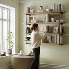 60 inch long tier wall mounted iron pipe shelving unit in a rich burnt finish, creating versatile vertical wall storage. This 4 tier shelving unit offers stylish organization for books, home décor, office essentials, and modern farmhouse spaces.
