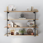 60 inch industrial pipe shelf with a rich burnt finish, styled as a 4 tier wall bookshelf for living room décor. This rustic pipe shelving unit combines farmhouse charm and modern storage for books, plants, and decorative accents.