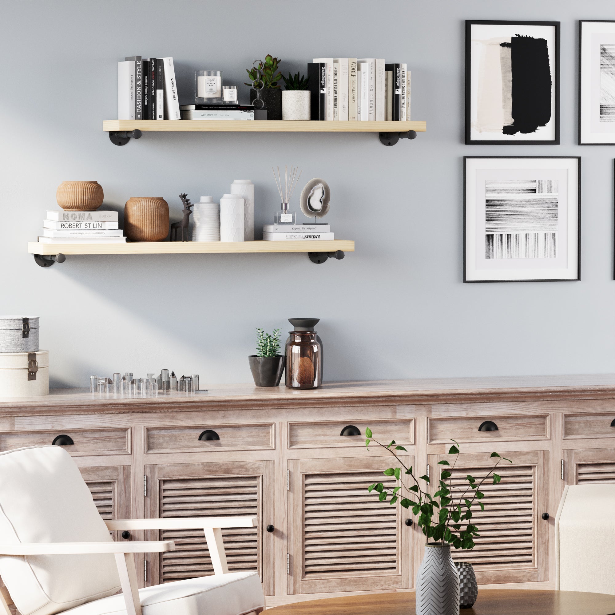 Modern interior with living room floating shelves, books, and decor against a light blue wall.