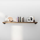 60 inch long floating pipe shelf styled with books and modern décor, featuring rustic wood and industrial pipe brackets. Ideal as a wall mounted bookshelf, living room shelf, entryway storage, or farmhouse wall décor accent.