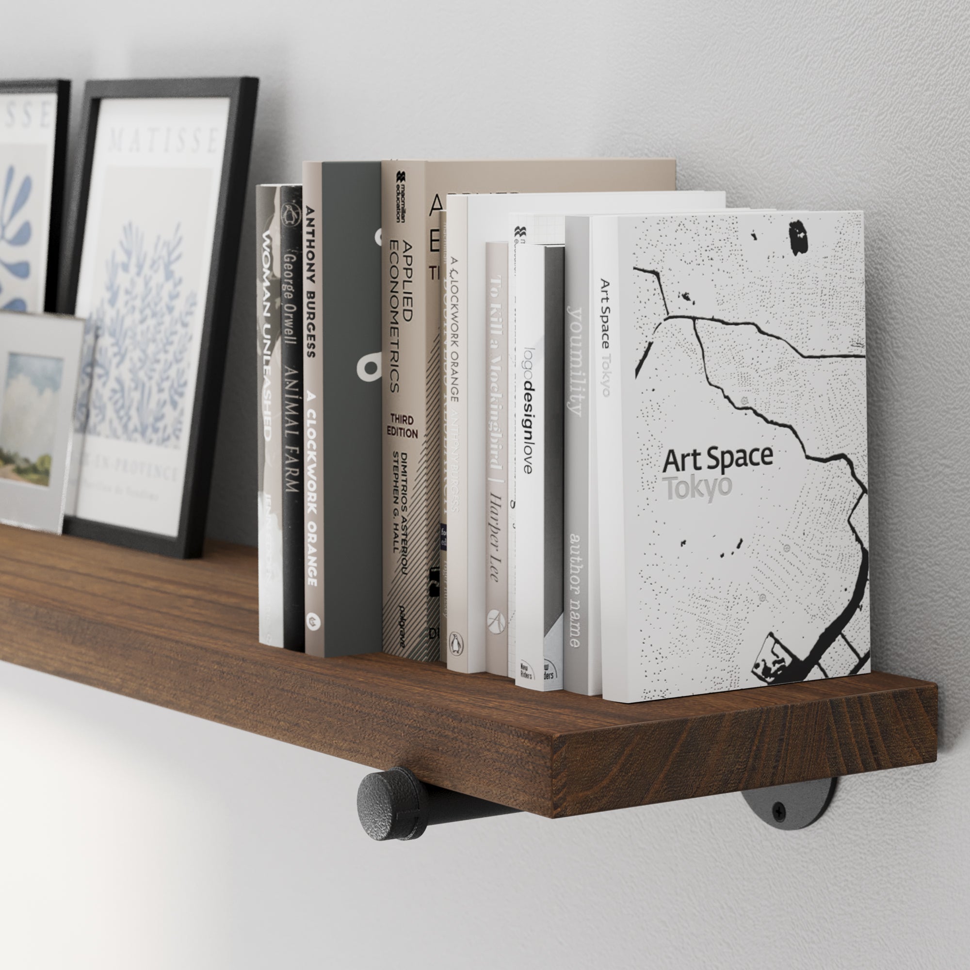A 72” long floating pipe shelf featuring a rich provincial wood finish and sturdy black pipe brackets. A long bookshelf wall shelf designed for books, framed prints, collectibles, and modern rustic home décor.