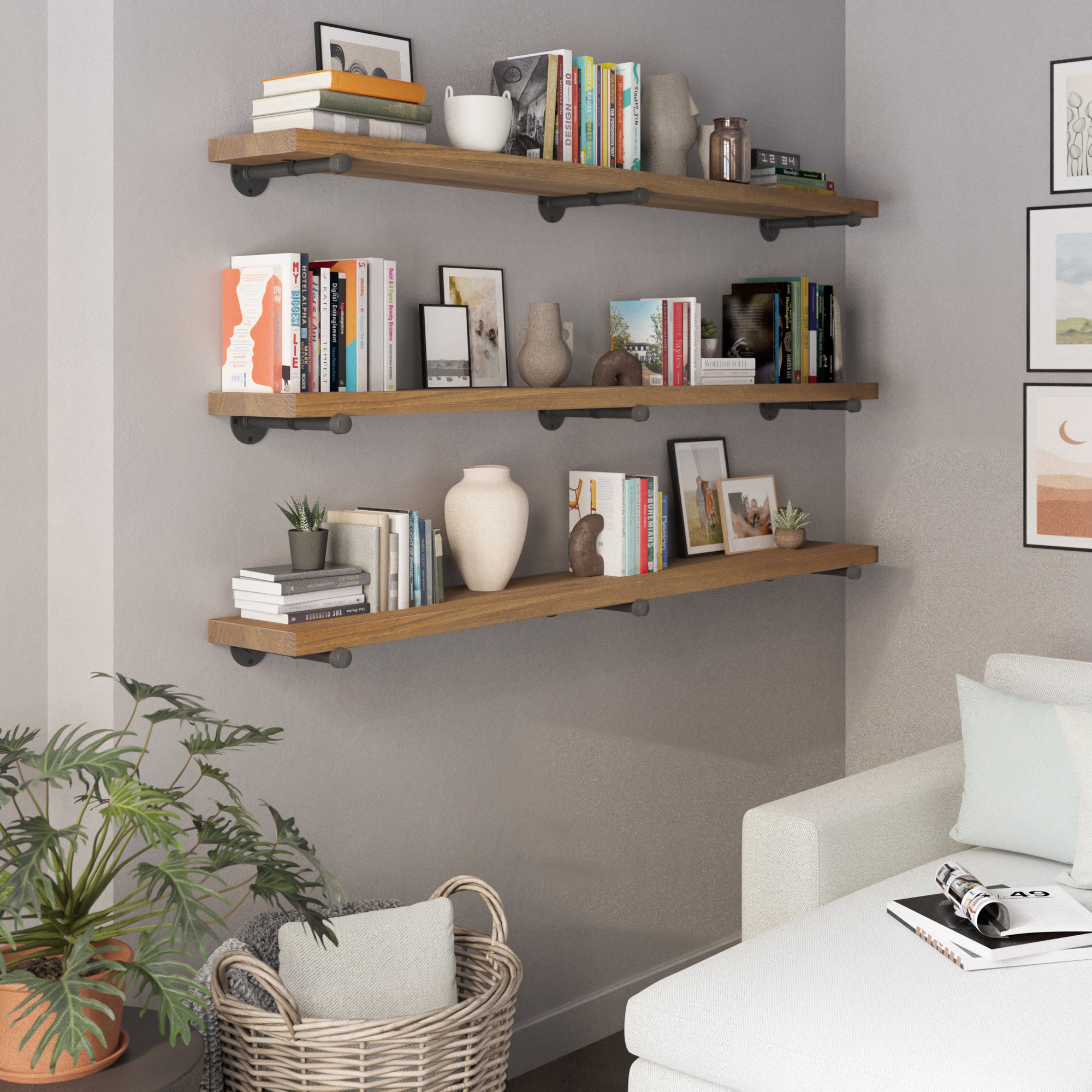 Three 72 inch long pipe shelves in a provincial finish create elegant wall storage for books, vases, plants, and décor. A rustic industrial shelving solution for living rooms, offices, apartments, or farmhouse interiors.