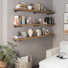 Three 72 inch long pipe shelves in a provincial finish create elegant wall storage for books, vases, plants, and décor. A rustic industrial shelving solution for living rooms, offices, apartments, or farmhouse interiors.