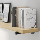 A 72” wall mounted long shelf featuring natural no-finish wood, hand-sanded for a raw and authentic texture. A long wall-mounted bookshelf for displaying décor, framed art, books, and modern farmhouse accents