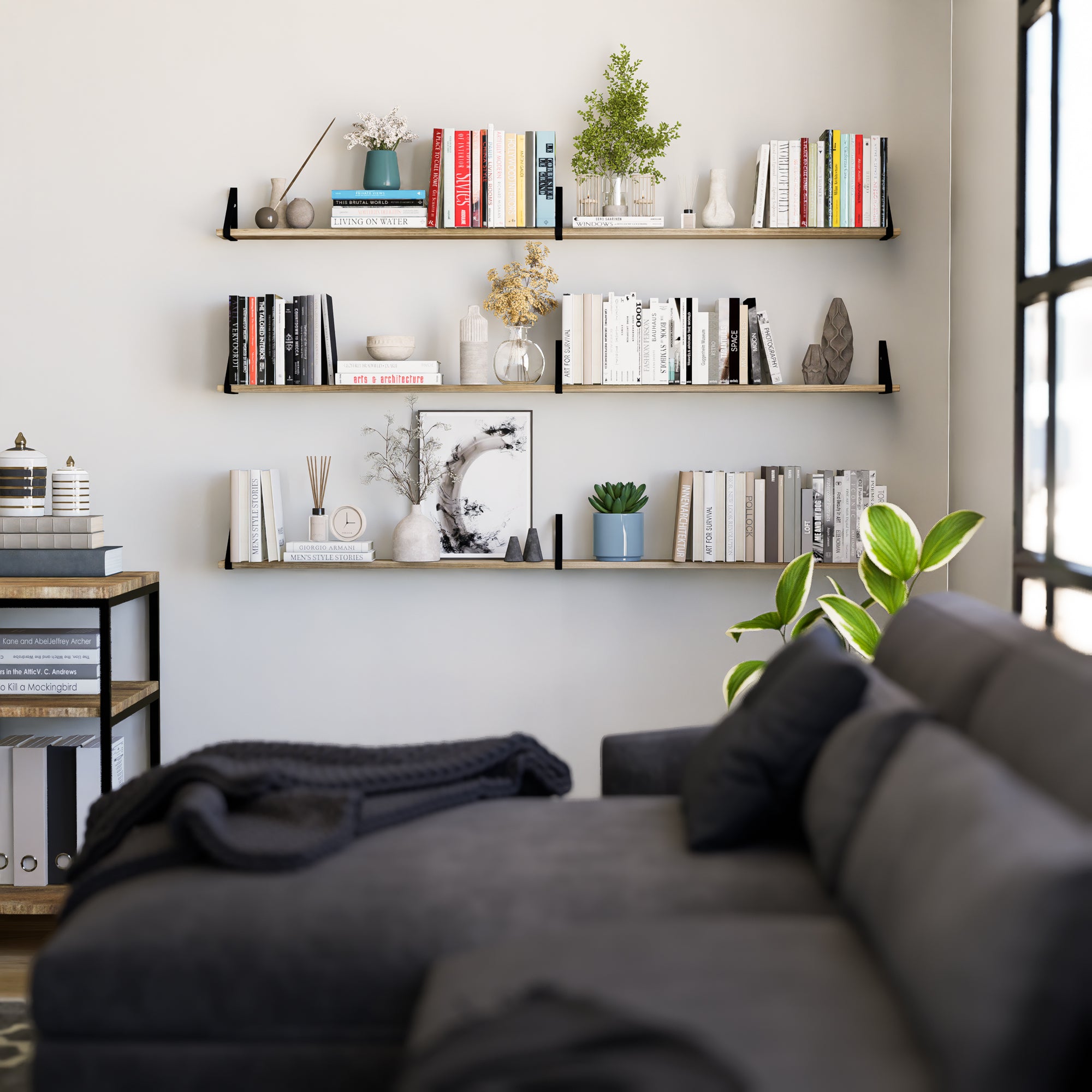 Spacious living room with multiple wall shelves for living room filled with books and decorative items, offering a cozy and stylish space.