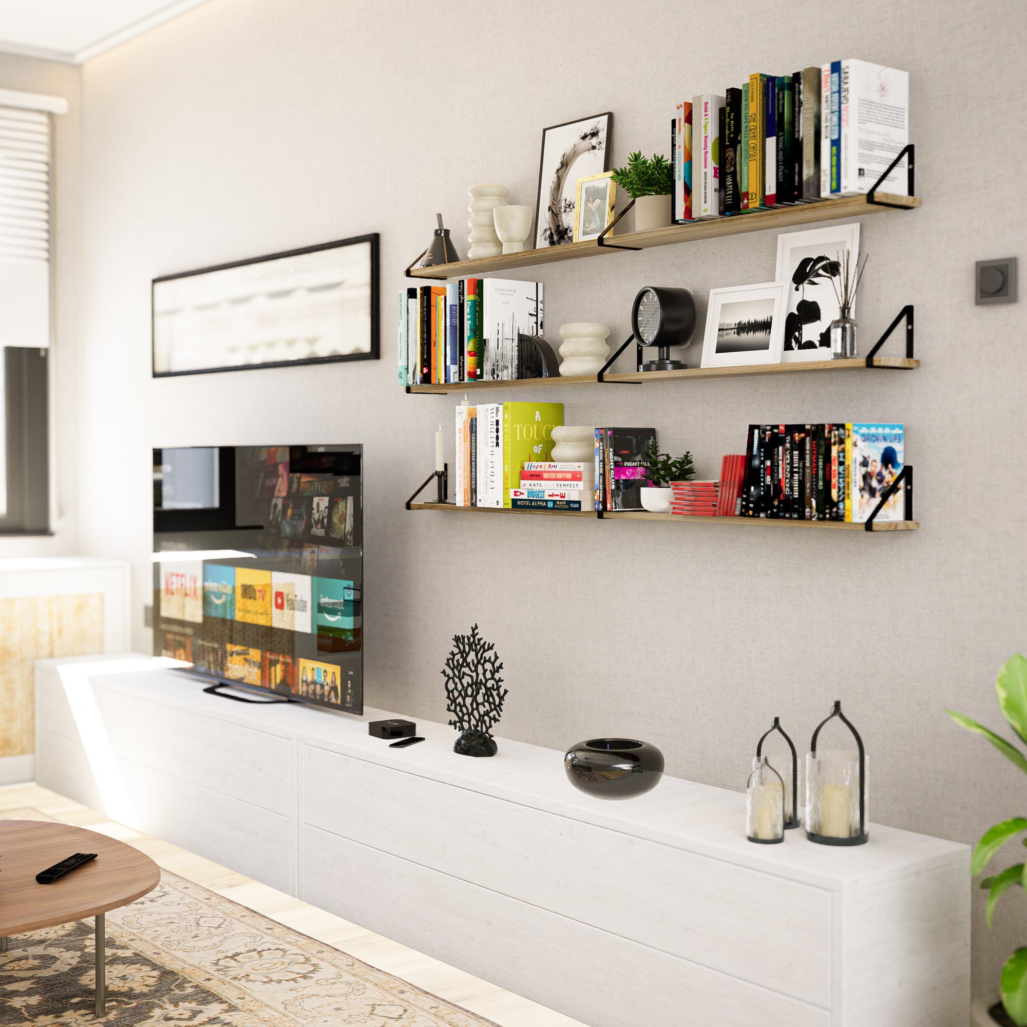 Modern living room setup with wall mount shelves displaying a variety of books, framed pictures, and decorative items.