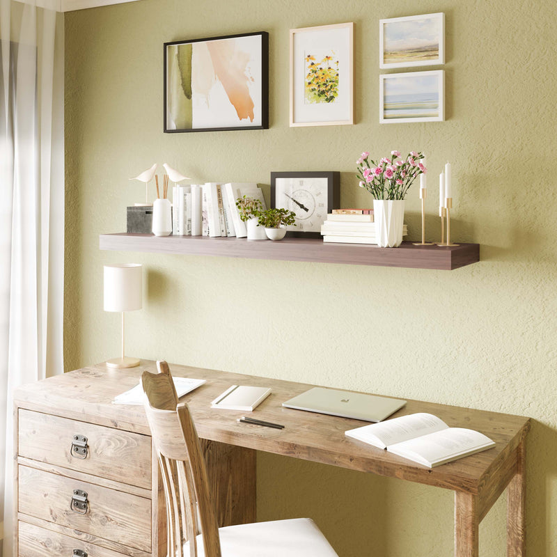 48'' office shelf shelf acts as a functional space above a desk, neatly organizing books, a laptop, and decorative items, enhancing a productive home office environment.