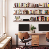 Multiple shelves for wall decor in a home office setting, filled with books and decor, creating an organized and inviting workspace with ample storage.