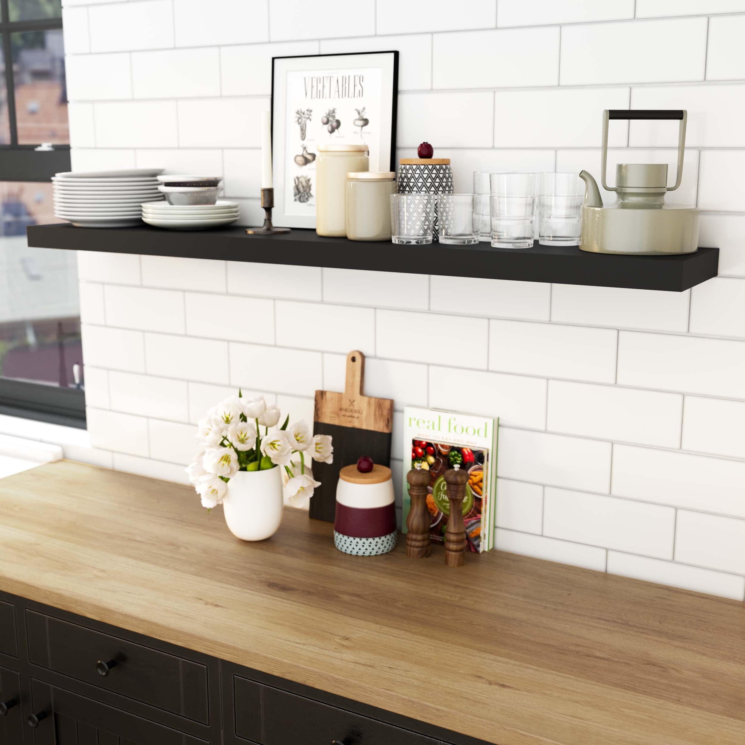 Modern kitchen with a kitchen storage shelf black displaying dishes, kitchen tools, and decorative items, creating a chic look.