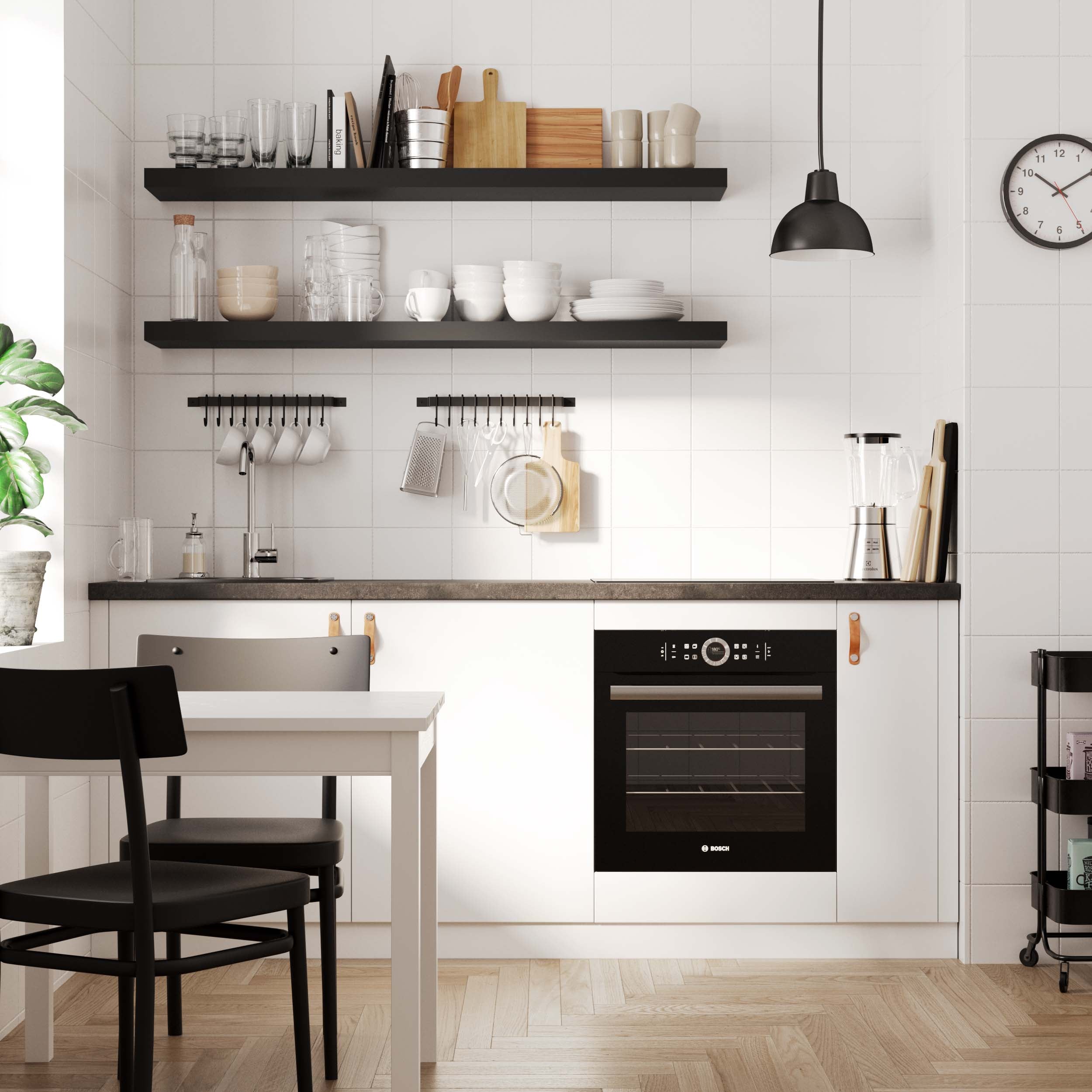 A modern kitchen scene featuring black shelves for wall neatly storing dishes, glasses, and cooking tools above a minimalist kitchen setup.