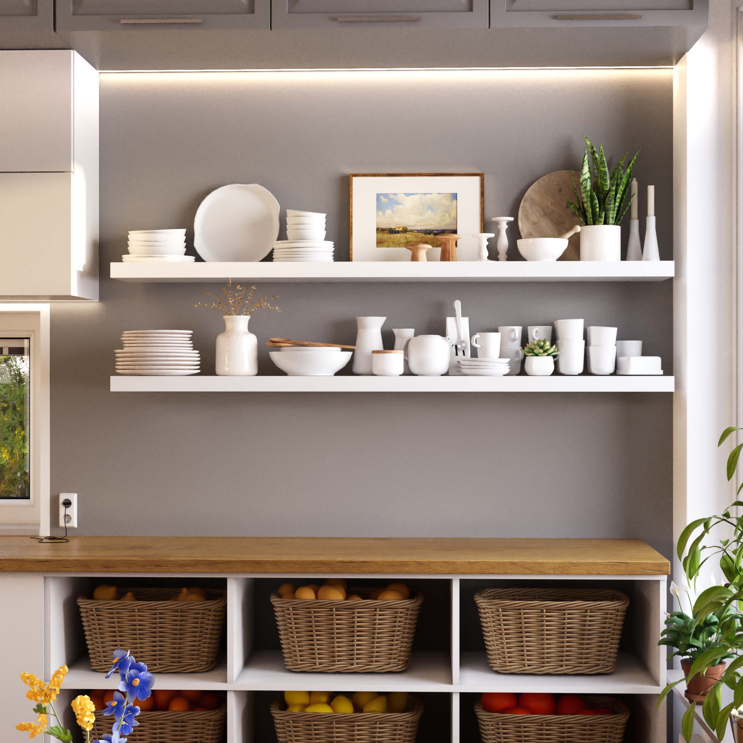Elegantly styled white floating shelves in a kitchen displaying plates, bowls, and other dishware.