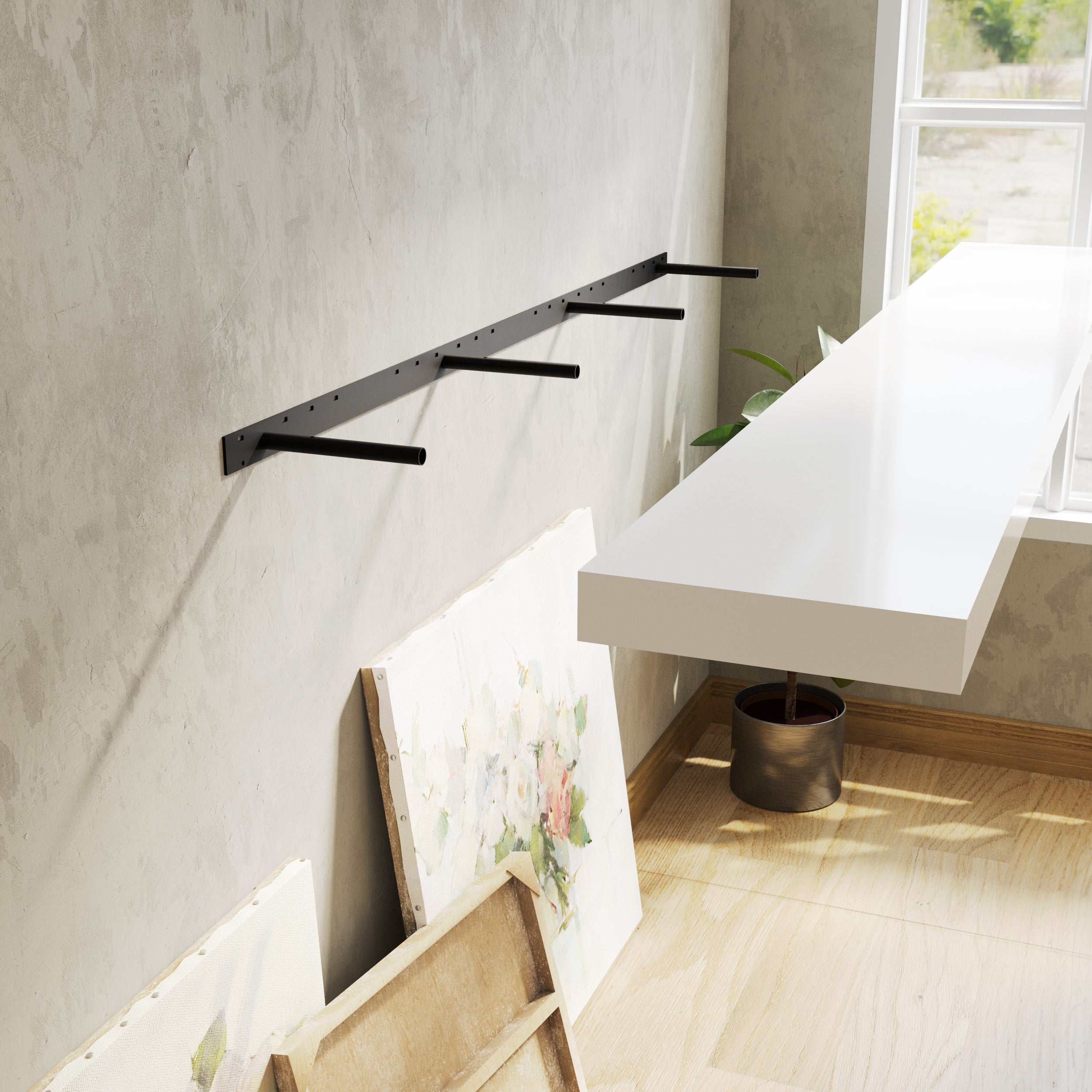 Bare wall mounted brackets holding a white floating shelf, hinting at a clean and modern setup.
