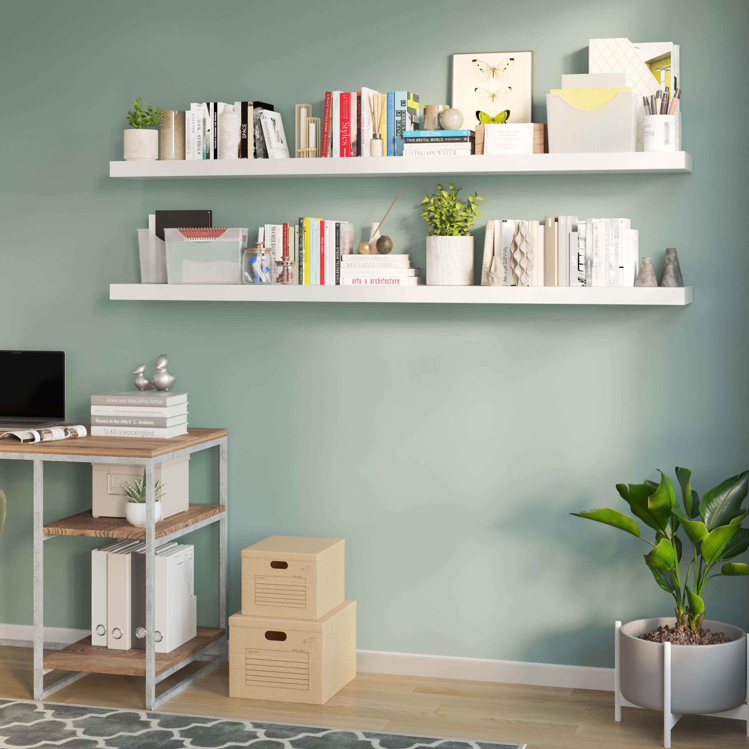 White office shelves for wall neatly lined with books, decorative boxes, and minimalistic decor against a soft green wall.
