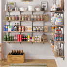 A neatly organized pantry shelf filled with bottled drinks, dry food items, and a wooden box of vintage wines, creating a rustic and functional kitchen space.