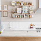 Modern kitchen with kitchen storage shelves with white adjustable brackets, sink, and countertop