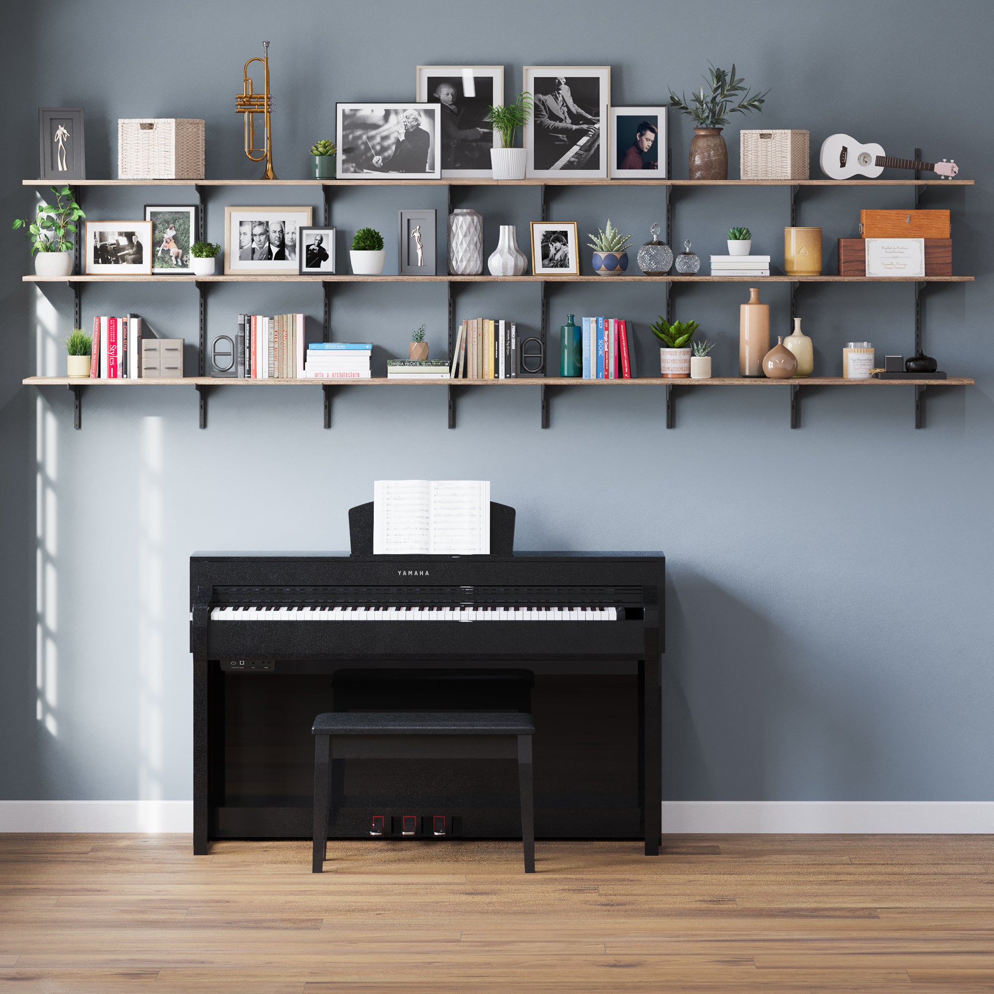 Storage shelving unit burnt with stylish art frames, books and other decorative items above a black piano.