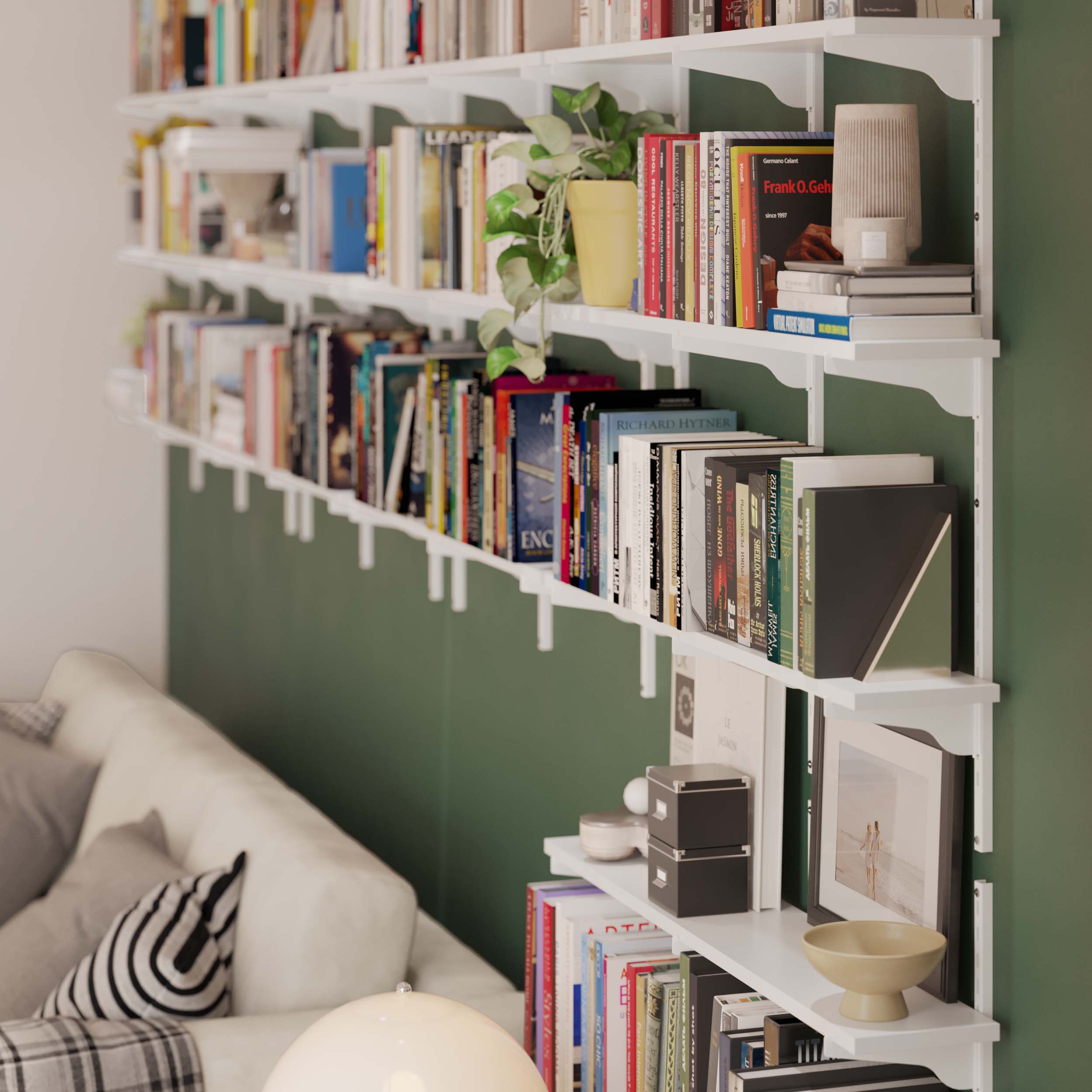 Living room with white wall bookshelves filled with a variety of colorful books.